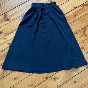 Yincra full length black skirt medium made of polyester/spandex.